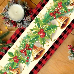 Christmas table runner with red bow and holly berries on rustic wooden background