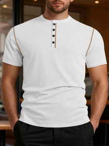 Detail of white waffle texture polo shirt with button placket and contrast stitching