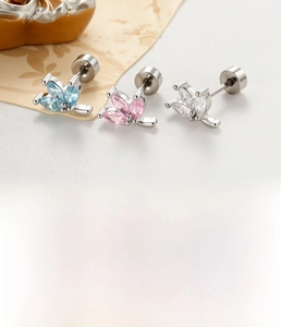 Macro detail of three-petal zircon leaf stud earrings in silver stainless steel