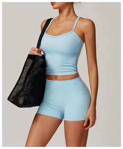 Close-up of light blue brushed yoga tank top and high waist shorts with matte finish