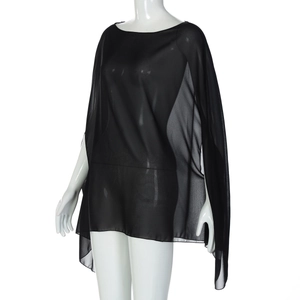 Detail view of black sheer chiffon poncho top on white mannequin with loose fit design