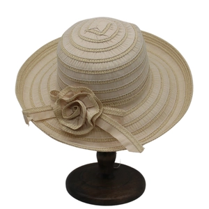 Striped wide-brim straw sun hat for women with elegant floral detail in beige color