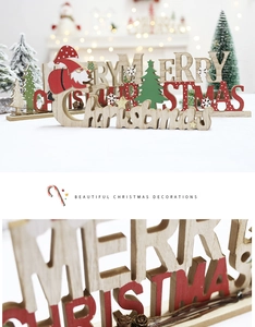 Detail of wooden Merry Christmas hanging decoration with Santa Claus and tree patterns