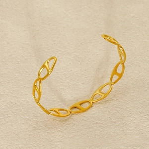 Detail view of 18K gold plated hollow link cuff bracelet with high polish finish