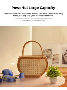 Close-up of handmade half-moon rattan bag with intricate woven texture and sturdy handle