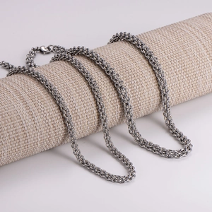 Sleek silver lantern chain necklace 6mm displayed on a minimalist textured stand