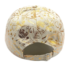 Detail of adjustable silver metal buckle on graffiti baseball cap with gold foil print
