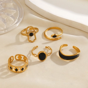 5-piece set of 18K gold plated stainless steel rings with black enamel flower designs
