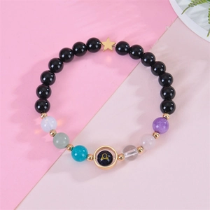 Detail of Libra zodiac bracelet with blue sandstone beads and gold star charm