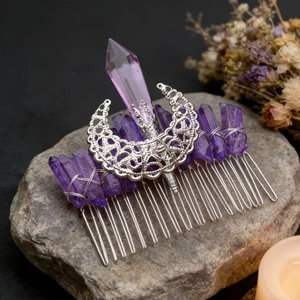 Detailed macro view of purple crystals and moon decoration on a silver hair comb