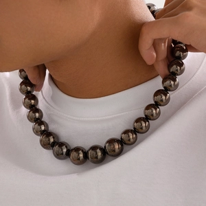 Men's hip hop chunky CCB bead necklace with dark metallic luster worn by model
