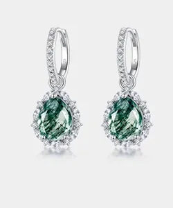 Detail of pear-cut moss agate earrings in S925 sterling silver with halo setting