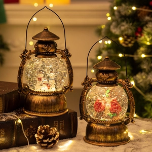 Vintage Christmas lantern music box with snow globe effect and warm LED lights