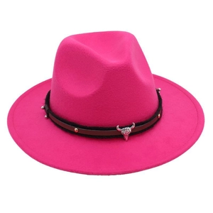 Detailed view of rose red fedora hat featuring a bull head buckle and ethnic braided band