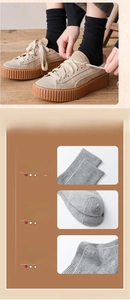 Detail of knit socks showing reinforced toe and elastic cuffs for arch support