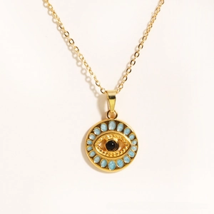 Close-up of titanium steel necklace featuring a blue and black Evil Eye charm pendant