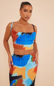 Detail of printed plissé fabric on crop camisole top and bodycon long skirt set