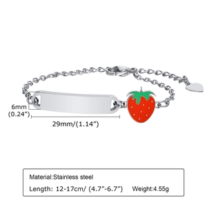 Detail of stainless steel bracelet with strawberry charm and engravable curved bar plate