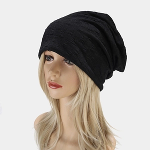 Minimalist black slouchy beanie with geometric jacquard texture for autumn street style