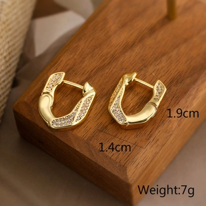 Detail view of 18k gold plated geometric earrings with size 1.9cm x 1.4cm and 7g weight