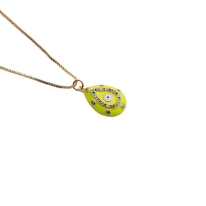 Macro shot of neon yellow teardrop evil eye pendant with colorful zircon stones