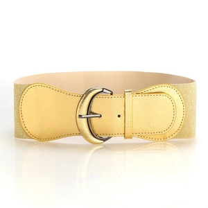 Macro shot of gold elastic waist belt with moon crescent metal buckle on white background