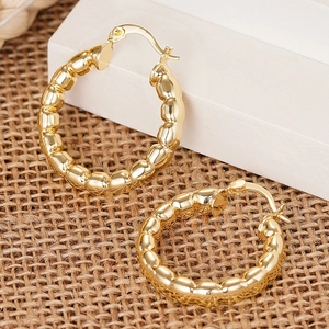 Elegante goldene Creolen mit Blasen-Textur-Design und polierter Metallic-Oberfläche