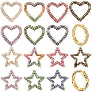 Detailed macro of gold copper heart and star connectors with multicolor zircon stones