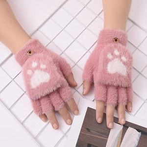 Detail of pink plush convertible mittens featuring a white cat paw print and brown button