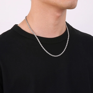 Silver twist rope chain necklace worn on model neck for a minimalist unisex fashion look