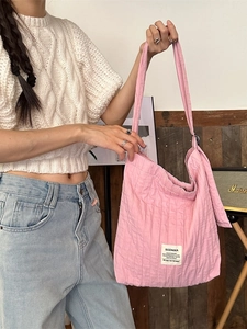 Pink pleated canvas tote bag for women featuring a minimalist vertical striped texture