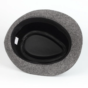 Detail of the jazz hat interior showing the 65% polyester 35% cotton fabric label and lining