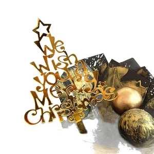 Golden acrylic Christmas tree cake topper with Merry Christmas engraving for holiday party