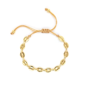 Golden coffee bean link bracelet with adjustable woven cord for a minimalist fashion look