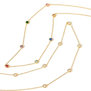 Minimalist gold necklace with colorful bezel-set round crystals in a stylish layout