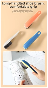 Detail showing an ergonomic long-handle shoe brush cleaning a white sneaker effectively