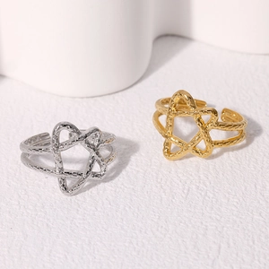 Minimalist stainless steel star rings in gold and silver with hammered metal texture