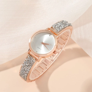 Elegant rose gold women's quartz watch with sparkling rhinestones and a silver starry dial