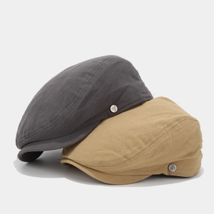 Retro unisex cotton flat caps in grey and khaki with vintage metal logo detail