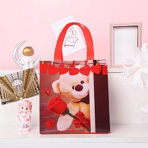 Waterproof non-woven Valentine's Day teddy bear gift bag with red hearts and handles