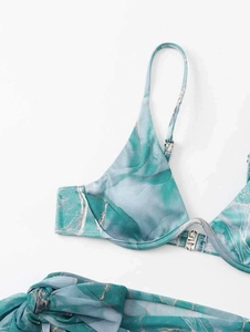 Detail of teal marble bikini top with adjustable straps and silver metal buckle