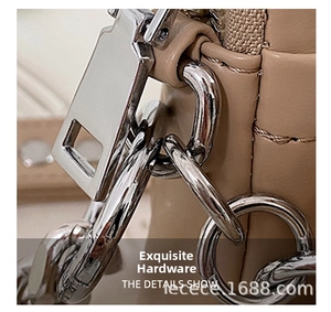 Close-up of premium silver hardware and chain on a stylish PU leather bear crossbody bag