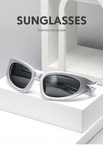 Cyberpunk Y2K sunglasses with silver frame and dark lenses on white geometric steps