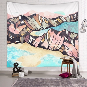 Detailed view of an abstract mountain tapestry on a white brick wall for home decor