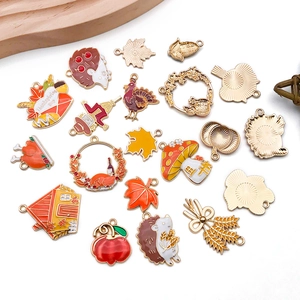 Detailed flat lay of Thanksgiving enamel charms including turkeys pumpkins and maple leaves