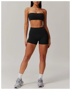Detailed view of women's black two-piece sports set with bandeau top and high-waist shorts