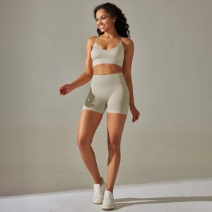 Detail of seamless ribbed yoga set featuring V-neck tank top and high-waisted shorts