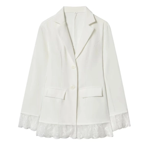 Detail of white slim-fit blazer showing delicate lace trim on sleeves and hem