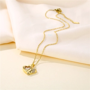 Elegant 18k gold plated stainless steel heart necklace with cubic zirconia on soft fabric