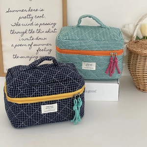 Quilted checkerboard cosmetic bag set with colorful tassels and soft cotton texture